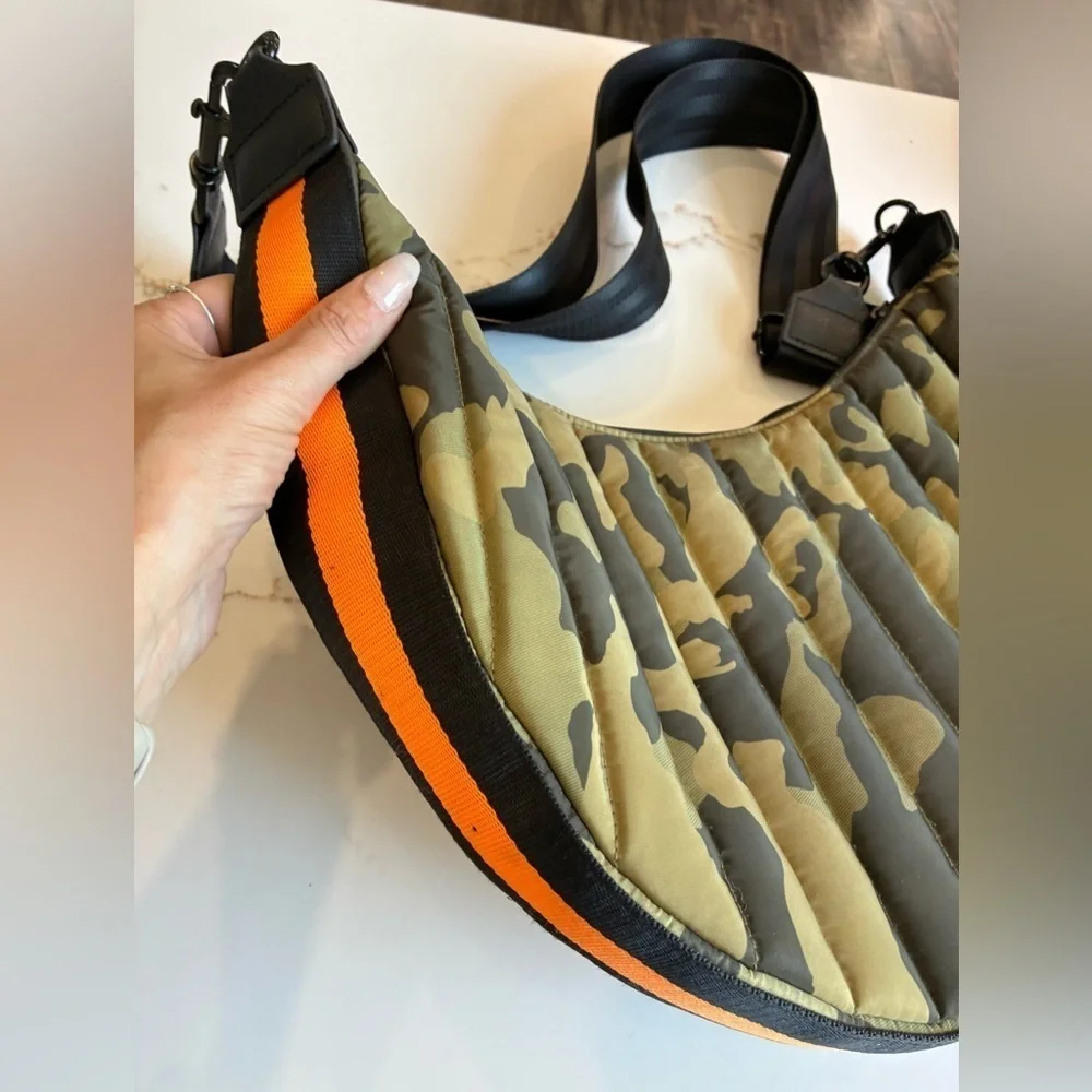 Think ROLYN camo green puffer crossbody bag with orange stripe